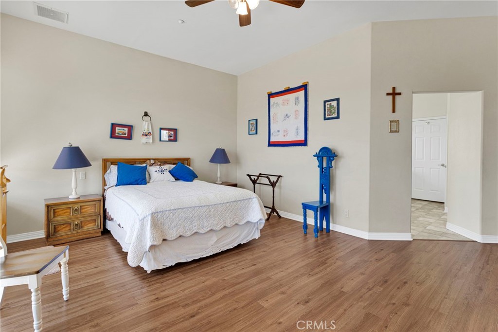 16222 Wild Road Helendale, CA 92342 - Photo 35 of 75 a bedroom with a bed and a chandelier