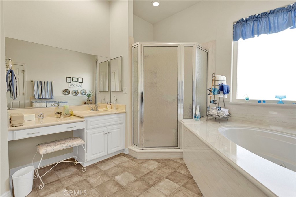 16222 Wild Road Helendale, CA 92342 - Photo 38 of 75 a bathroom with a tub sink and mirror