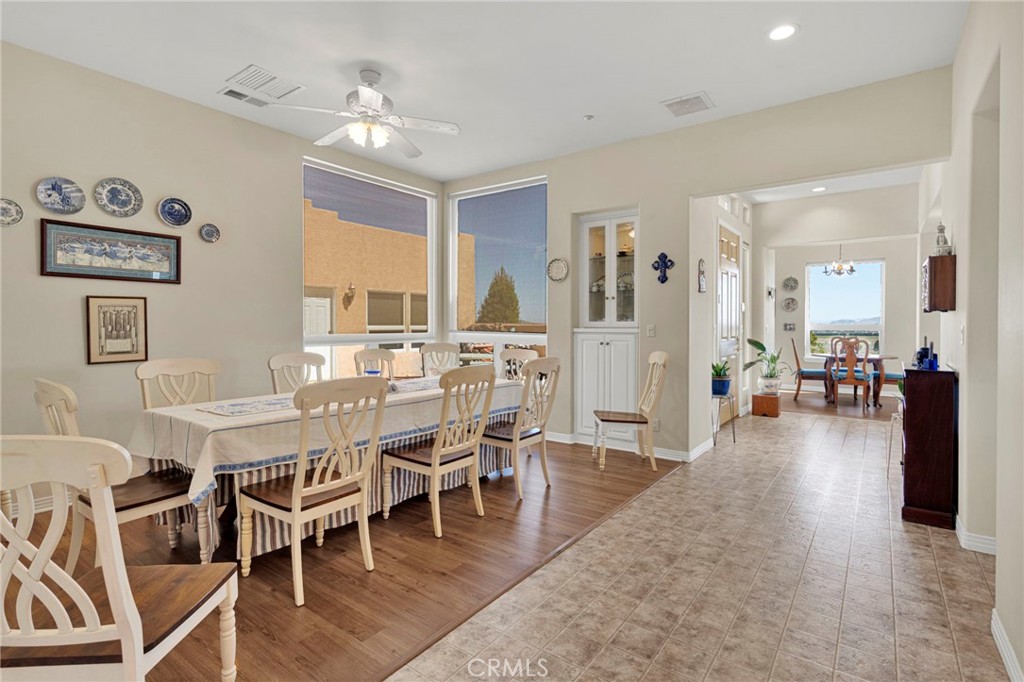 16222 Wild Road Helendale, CA 92342 - Photo 41 of 75 a dining room with furniture and wooden floor
