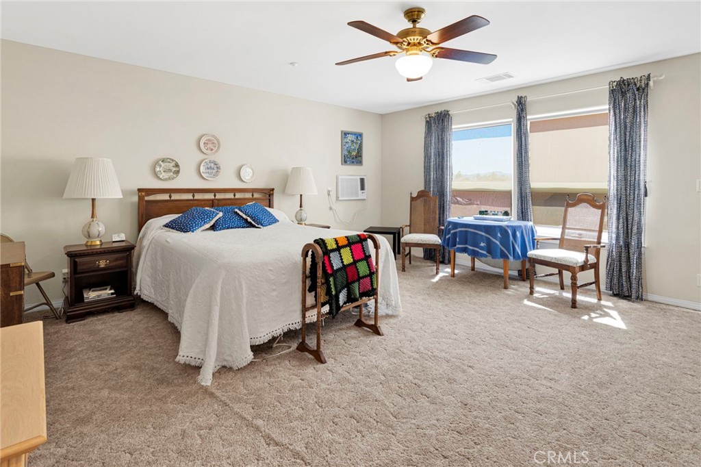 16222 Wild Road Helendale, CA 92342 - Photo 44 of 75 a bedroom with furniture and a large window