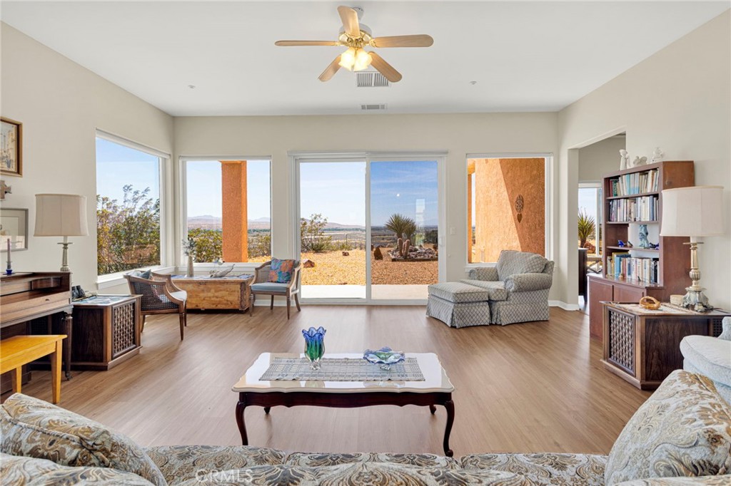 16222 Wild Road Helendale, CA 92342 - Photo 8 of 75 a living room with furniture and a large window