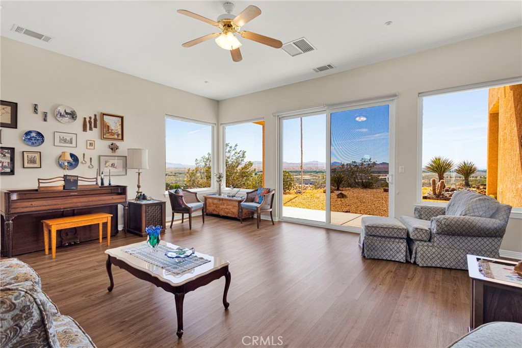 16222 Wild Road Helendale, CA 92342 - Photo 9 of 75 a living room with furniture and a large window