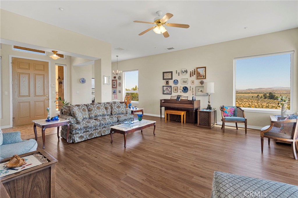 16222 Wild Road Helendale, CA 92342 - Photo 10 of 75 a living room with fireplace furniture and a wooden floor