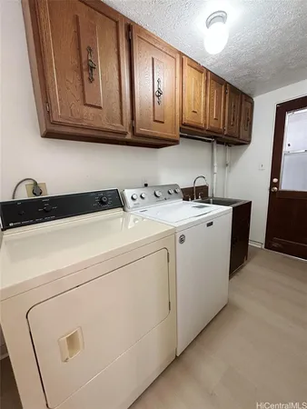 a utility room with cabinets