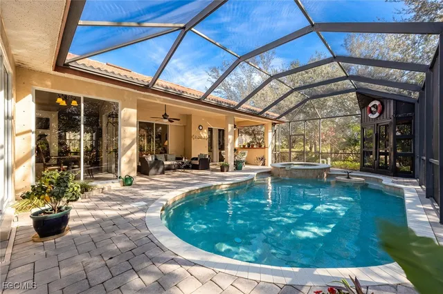 a view of a swimming pool with outdoor seating