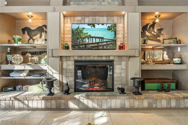 a living room with furniture and a view of kitchen