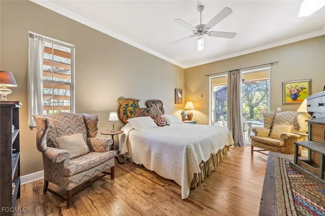 a bedroom with furniture and a chandelier