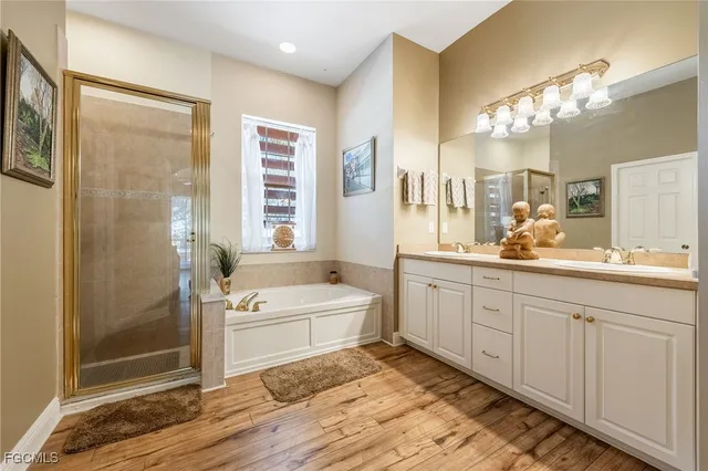 a bathroom with bathtub and shower