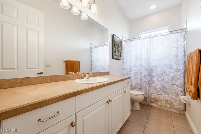 a bedroom with a bed and a table in it