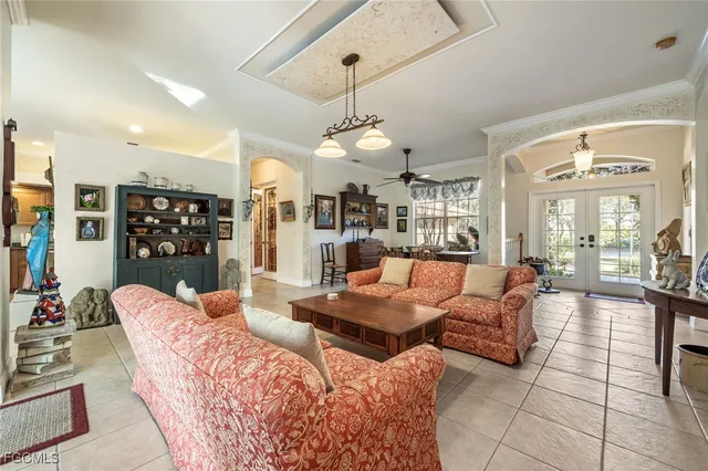 a dining room with furniture a chandelier and a rug