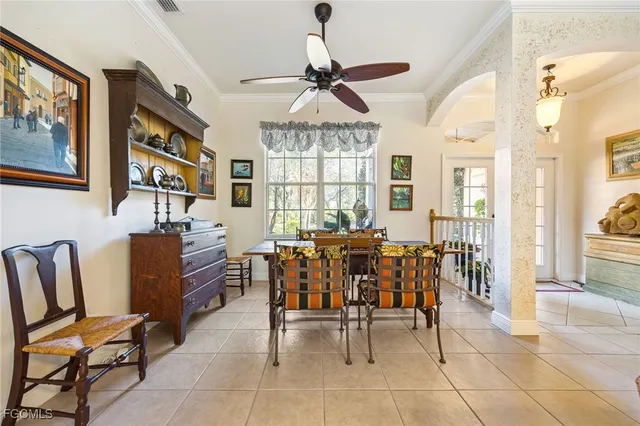 a living room with lots of furniture and white walls