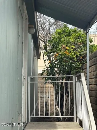 a view of a house with a street