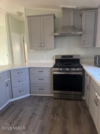 a view of a kitchen with a sink and cabinets