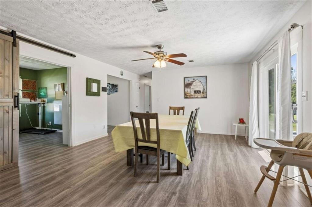 795 Tanner Road Dacula, GA 30019 - Photo 15 of 47 a view of a dining room with furniture and a window