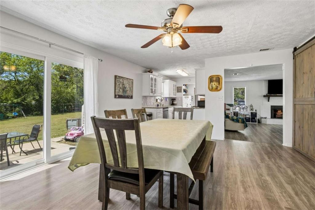 795 Tanner Road Dacula, GA 30019 - Photo 16 of 47 a view of a dining room with furniture window and wooden floor