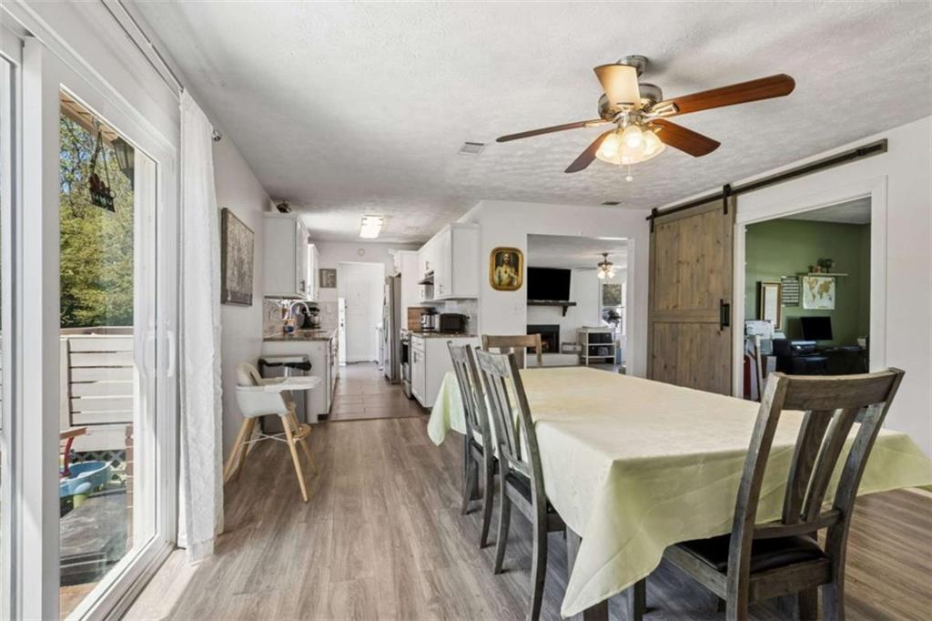 795 Tanner Road Dacula, GA 30019 - Photo 17 of 47 a view of a dining room with furniture window and wooden floor