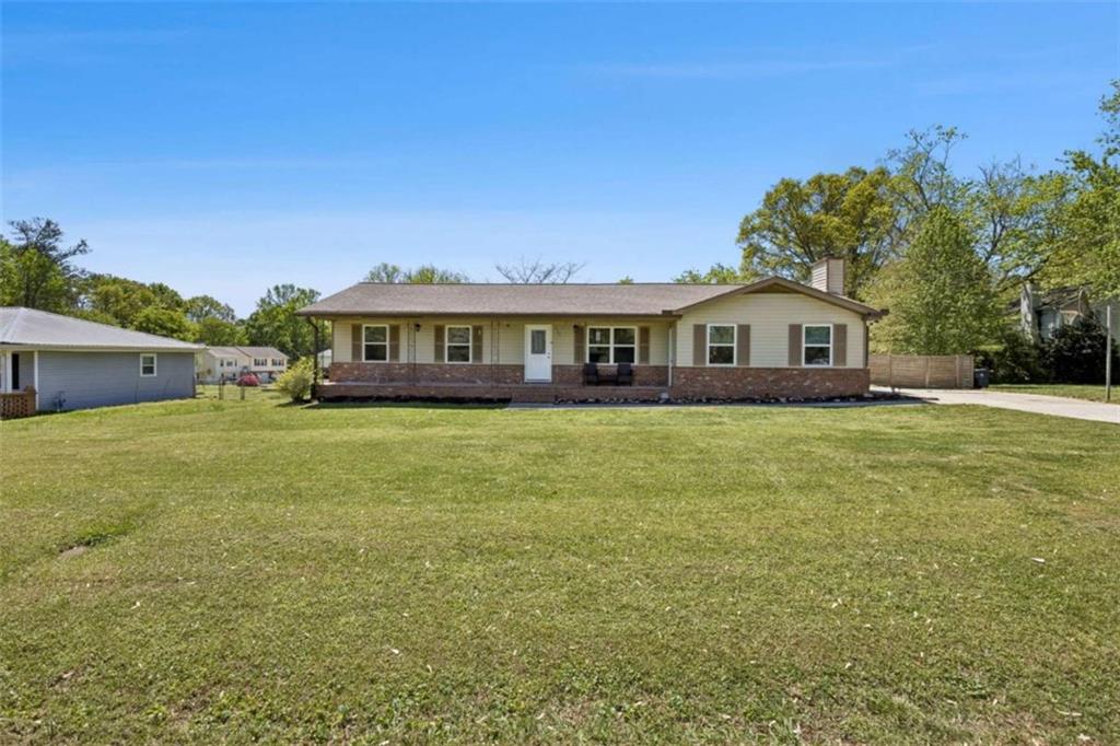 795 Tanner Road Dacula, GA 30019 - Photo 2 of 47 a view of house with a big yard