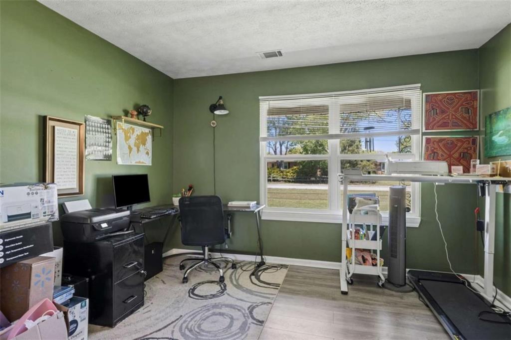 795 Tanner Road Dacula, GA 30019 - Photo 26 of 47 a view of a workspace with furniture and a window