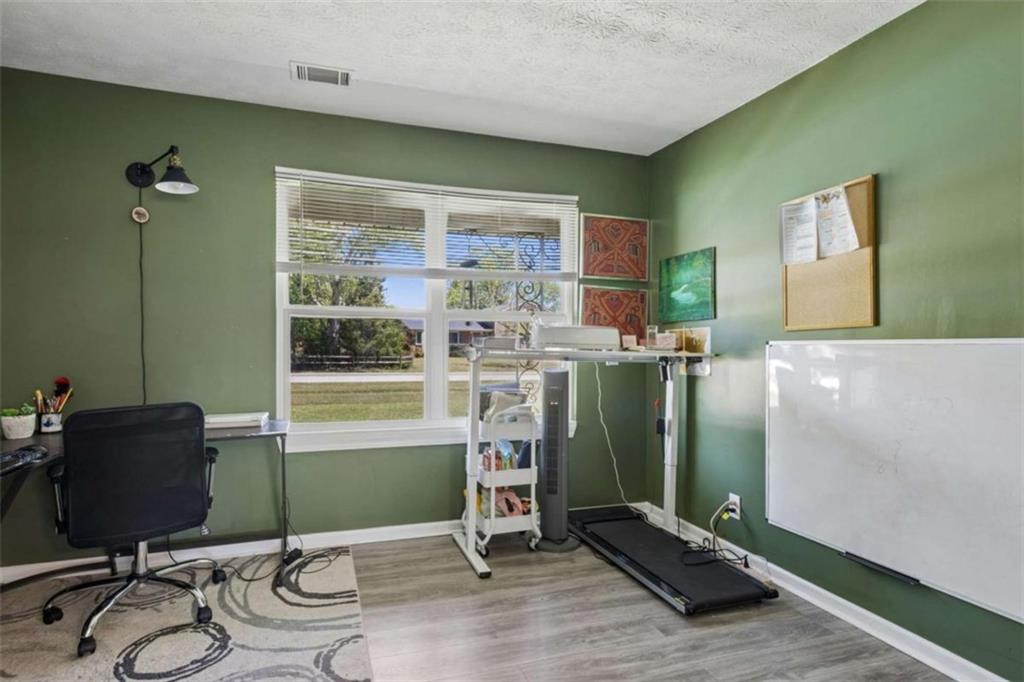 795 Tanner Road Dacula, GA 30019 - Photo 27 of 47 a workspace with furniture and windows