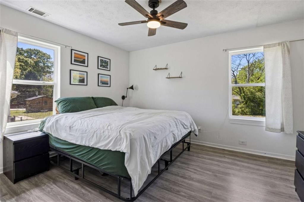 795 Tanner Road Dacula, GA 30019 - Photo 29 of 47 a bedroom with a bed and window