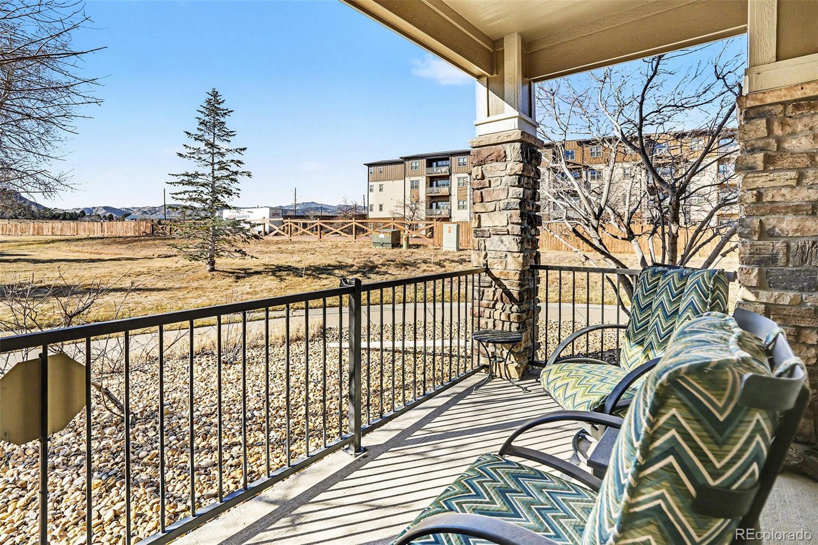 6293 Kilmer Loop, Unit 101 Golden, CO 80403 - Photo 16 of 17 a view of a city from a balcony