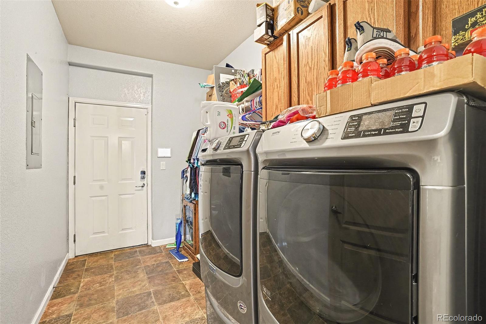 6293 Kilmer Loop, Unit 101 Golden, CO 80403 - Photo 17 of 19 a utility room with dryer and washer