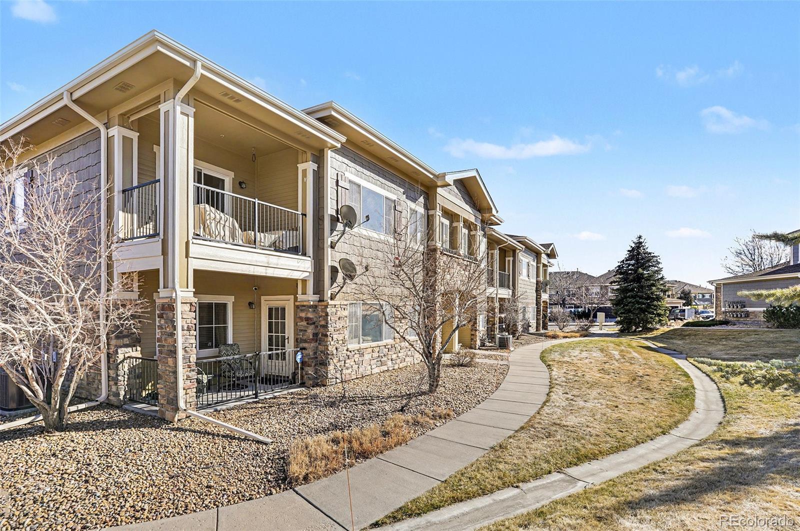 6293 Kilmer Loop, Unit 101 Golden, CO 80403 - Photo 19 of 19 a view of a house with a park