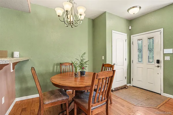 a view of a dining room with furniture and window