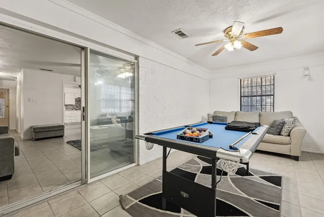 a workspace with furniture and view of bathroom