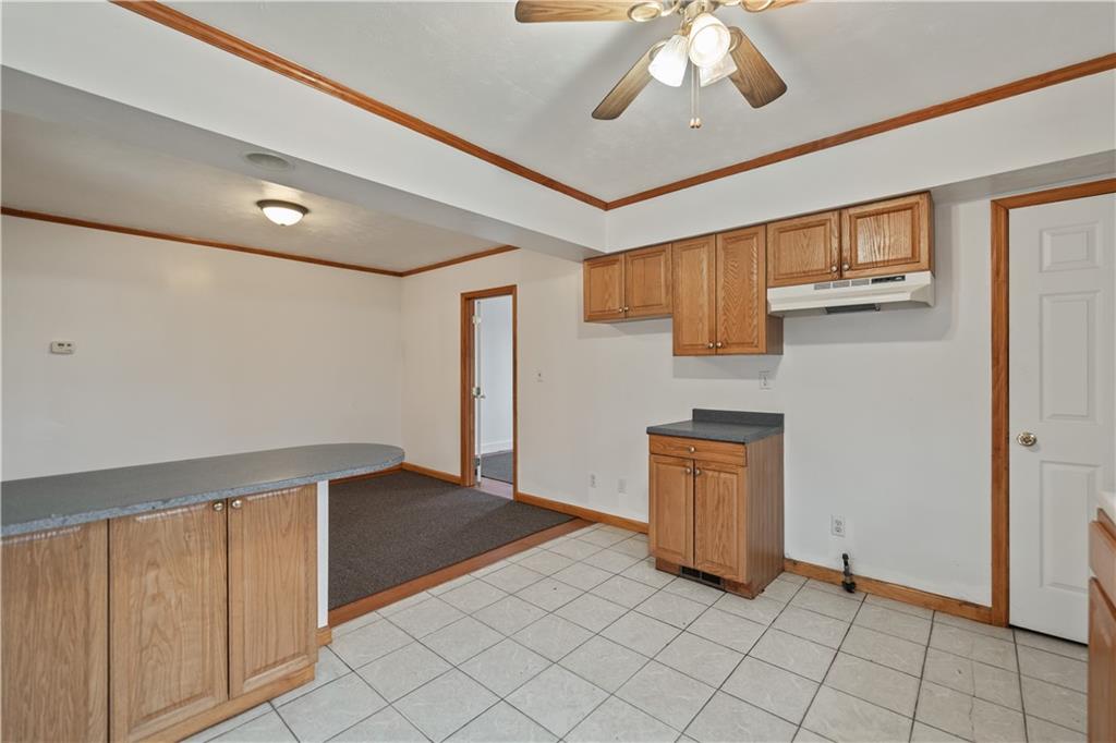 230 West Marigold Street Homestead, PA 15120 - Photo 29 of 50 a view of a livingroom with an entryway and a ceiling fan