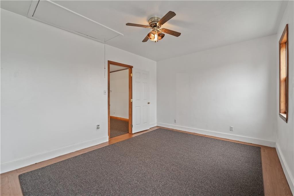 230 West Marigold Street Homestead, PA 15120 - Photo 37 of 50 an empty room with a window and a fan