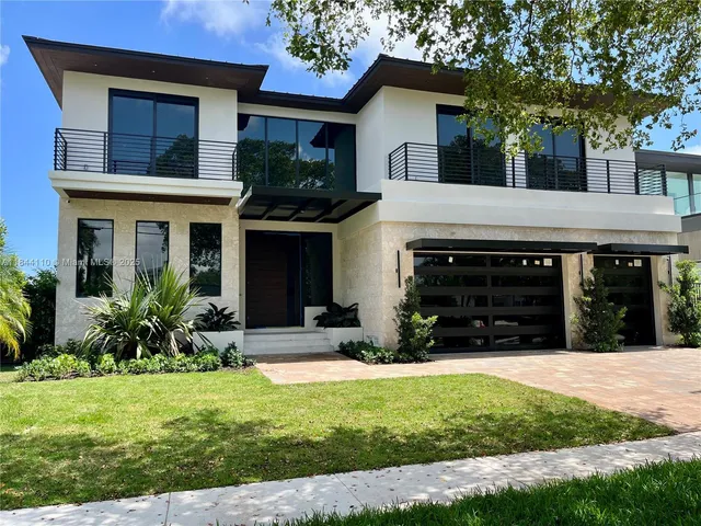 a view of a house with a yard patio and a yard
