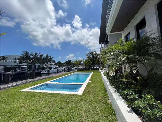 a view of swimming pool with a garden