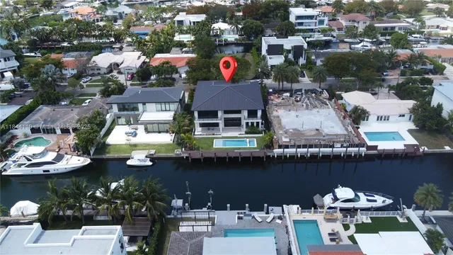 an aerial view of houses with yard