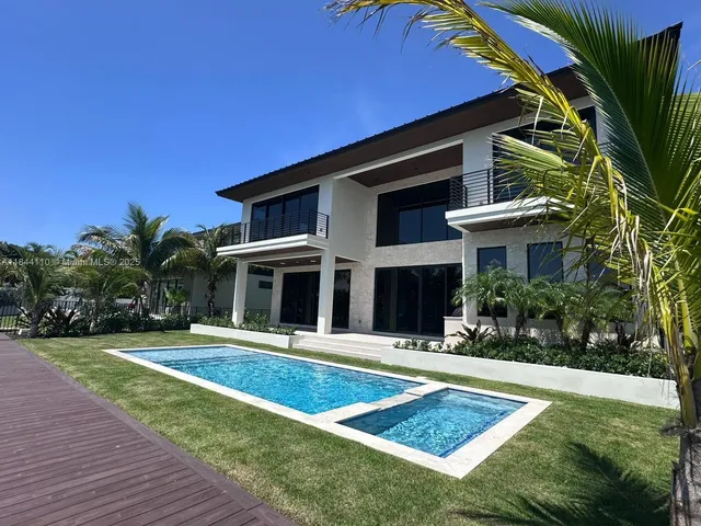 a front view of a house with yard
