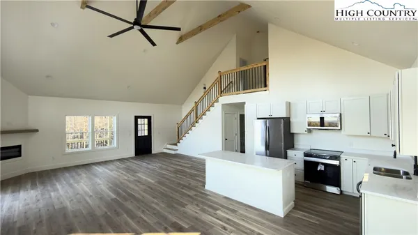 a view of a kitchen with a sink cabinets and a window