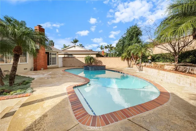 a kitchen with stainless steel appliances granite countertop a stove and a microwave