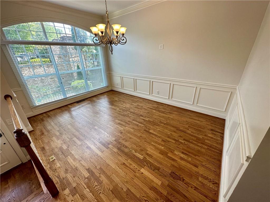 1615 Rivers Edge Trail Northeast Atlanta, GA 30324 - Photo 5 of 26 wooden floor in an empty room with a window