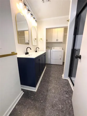 a view of a bathroom with tub sink and mirror