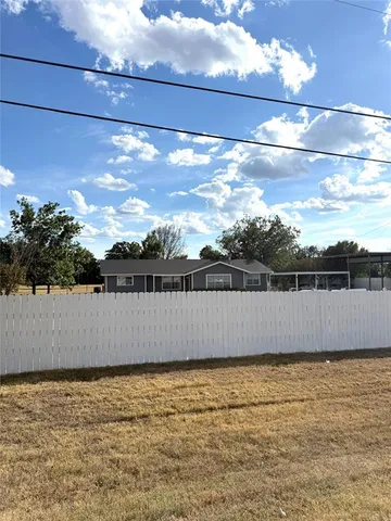 a view of a swimming pool and outdoor seating