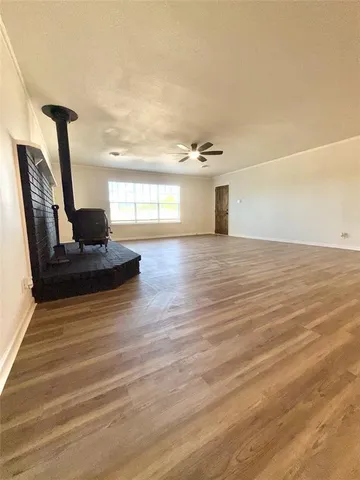 a view of a room with wooden floor and chair