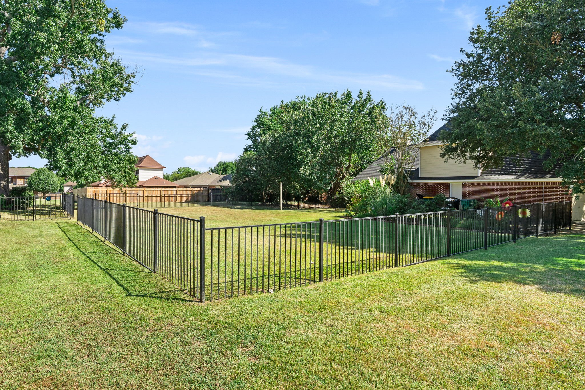 6971 Breezy Point Willis, TX 77318 - Photo 37 of 49 This is the adjacent fenced lot that can also be purchased with the house, but not included.