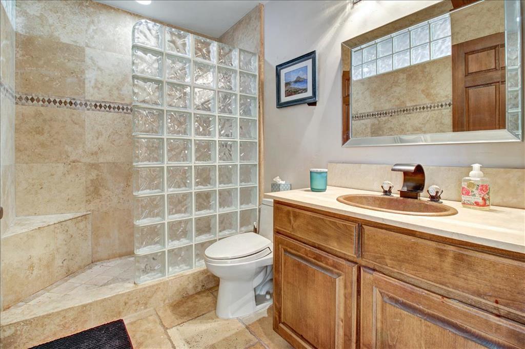 4820 Opal Cliff Drive, Unit 102 Capitola, CA 95010 - Photo 17 of 38 a bathroom with a sink toilet and shower