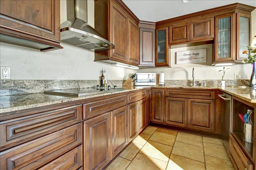 4820 Opal Cliff Drive, Unit 102 Capitola, CA 95010 - Photo 20 of 38 a kitchen with stainless steel appliances granite countertop a sink stove and cabinets