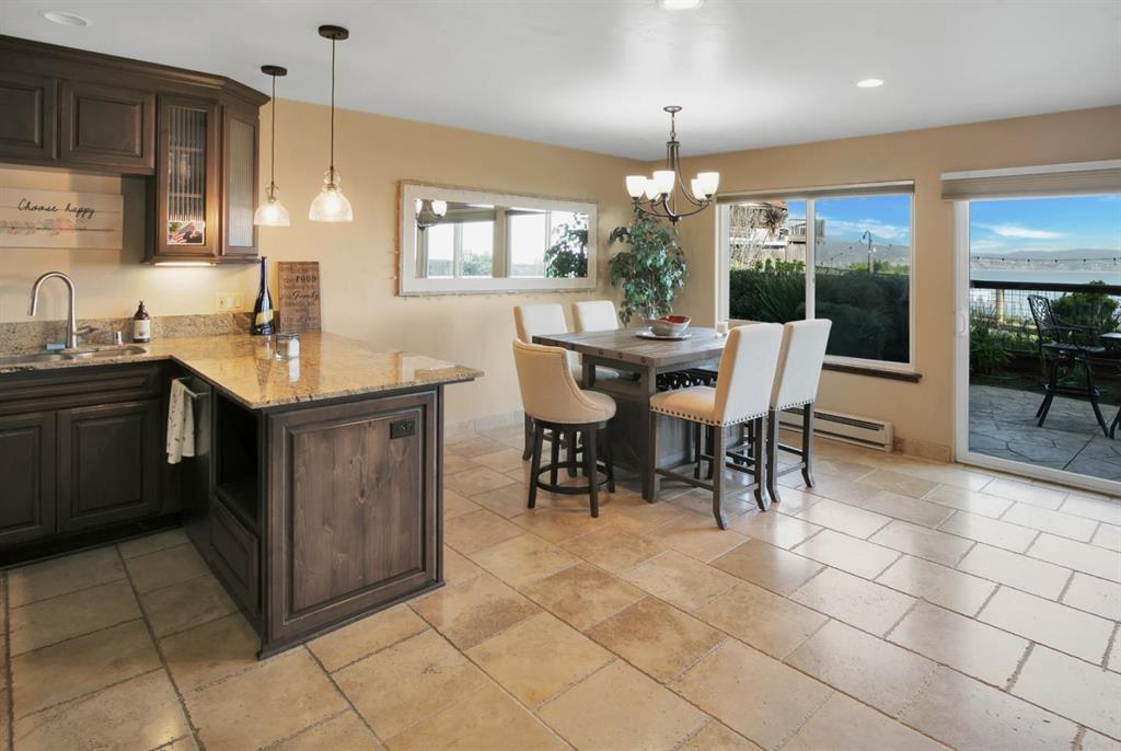 4820 Opal Cliff Drive, Unit 102 Capitola, CA 95010 - Photo 8 of 38 a kitchen with a sink a counter top space appliances and cabinets