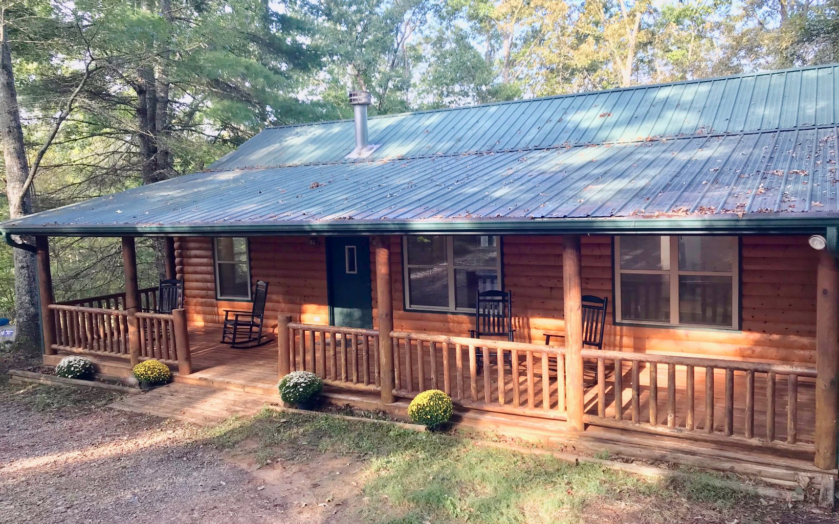 31 Tamme Road Blue Ridge, GA 30513 - Photo 1 of 1 a view of a house with a yard and wooden fence