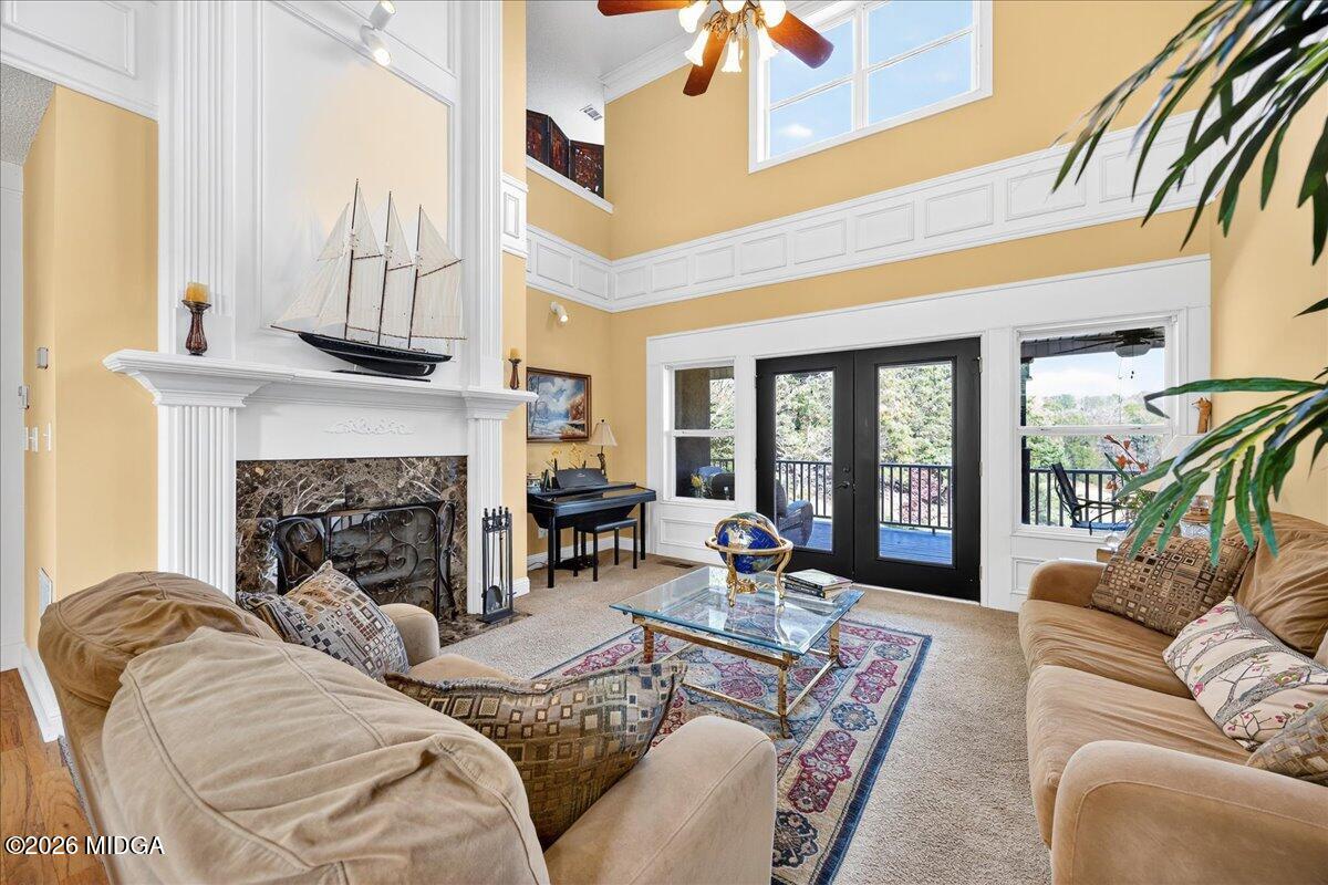 518 River Overlook Forsyth, GA 31029 - Photo 13 of 96 a living room with furniture fireplace and a large window
