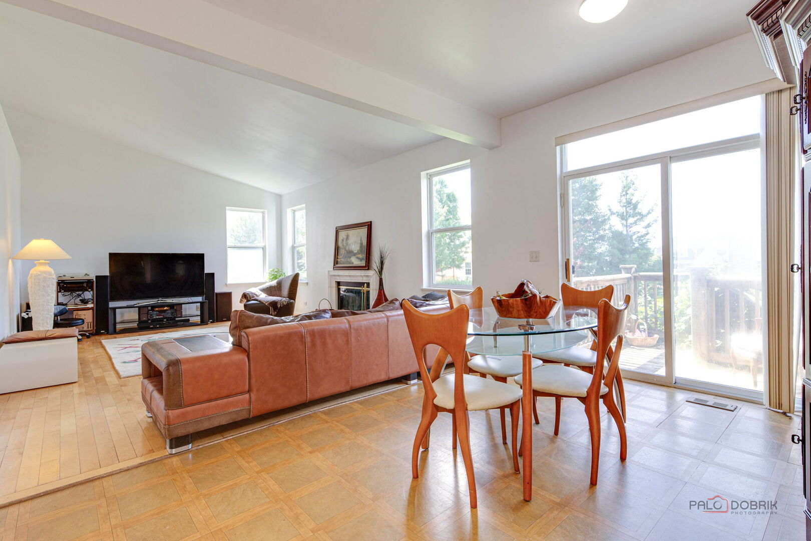 2227 Trailside Lane Wauconda, IL 60084 - Photo 12 of 37 a living room with furniture a flat screen tv and a large window