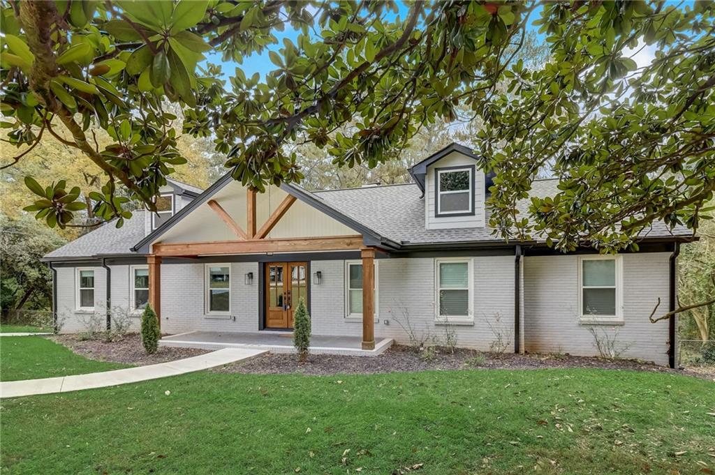 front view of a house with a yard