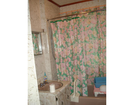 258 Upland Road Cambridge, MA 02140 - Photo 6 of 7 a bathroom with a sink and a shower curtain